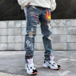 Graffiti ripped jeans - Image 8
